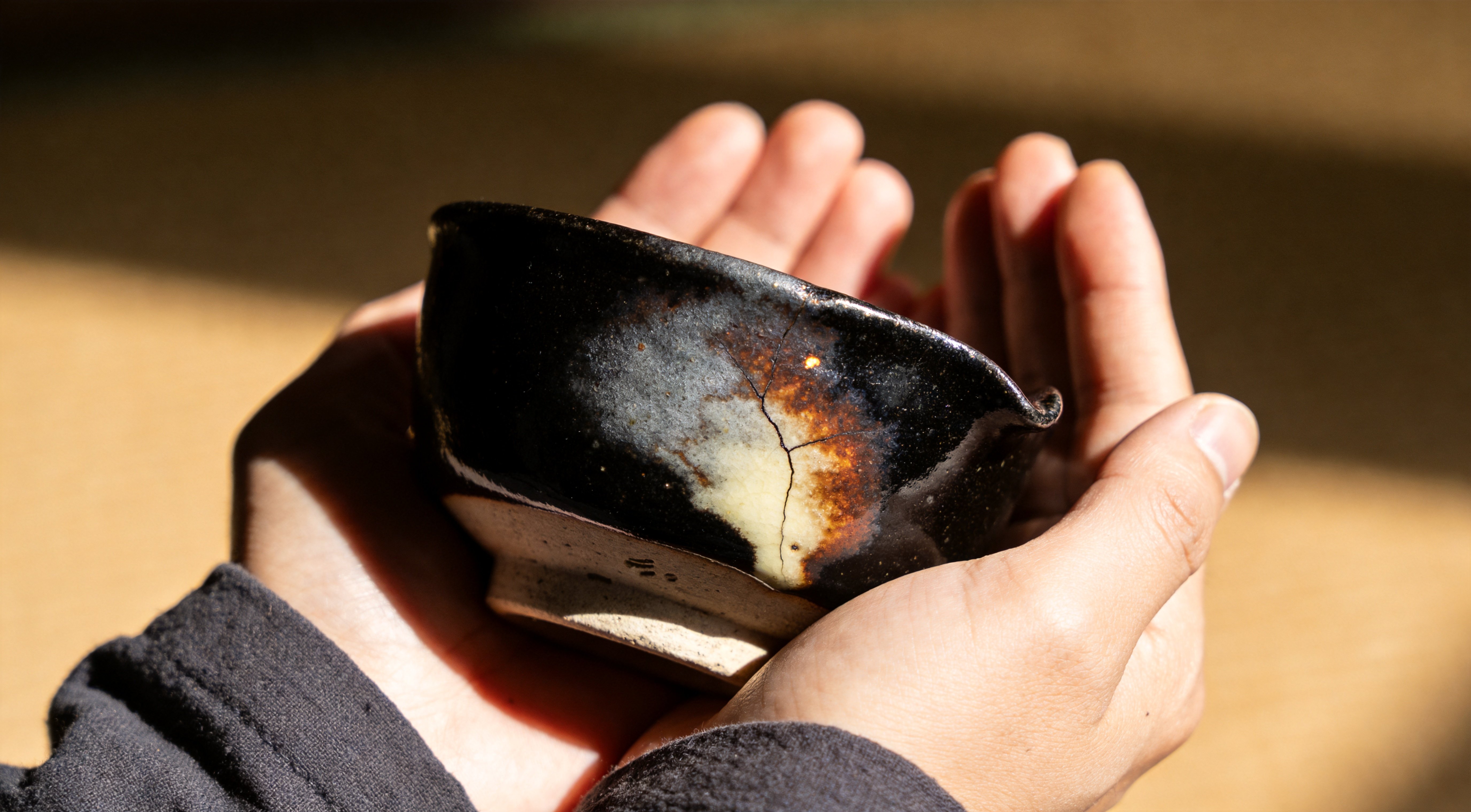 Raku Tea Bowl in Hands — Japanese Tea Ceramics and the Beauty of Imperfection